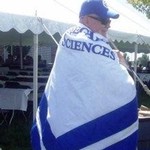 side view of dean wearing the CLAS banner